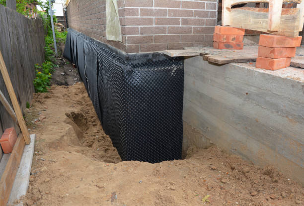 SJ Waterproofing Pros technician performing targeted Waterproofing assessment in Niles, OH